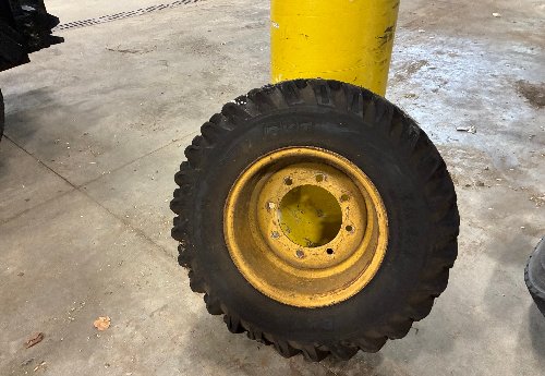 Backhoe rim and tire