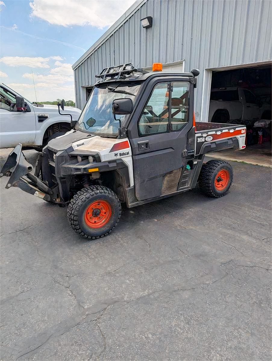 Bobcat Utility Vehicle with Front Blade and Power Broom