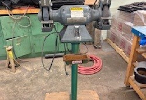 Baldor Bench Grinder on pedestal with lighted shields