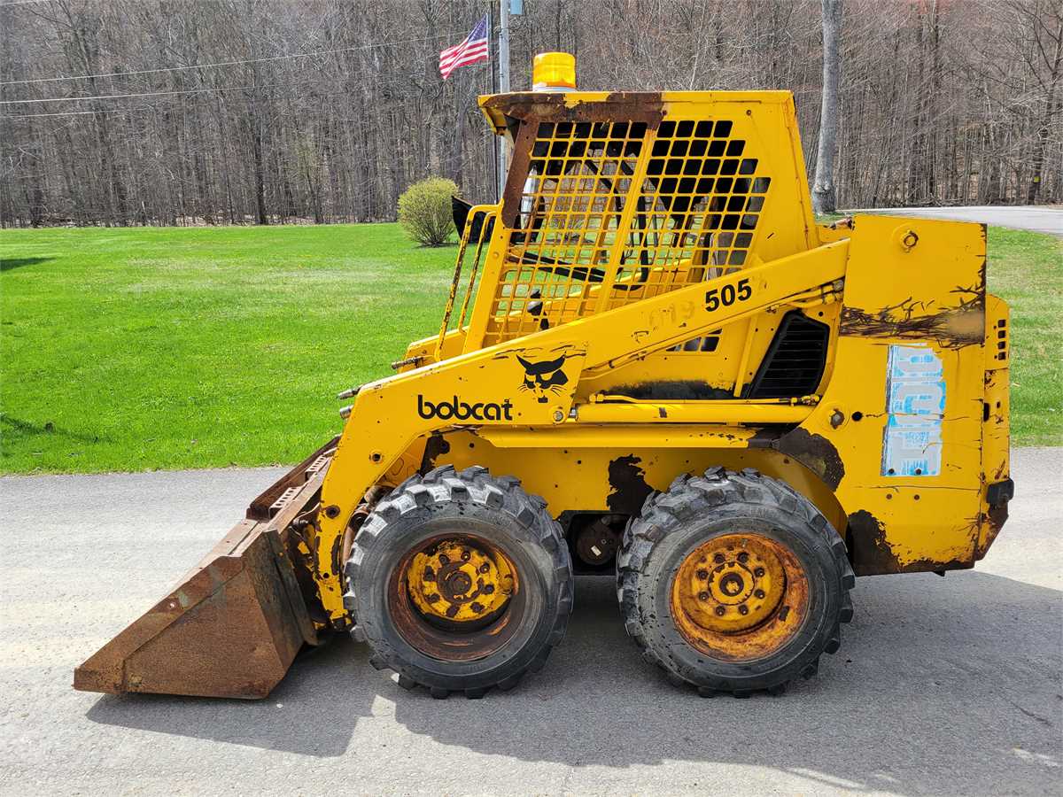 yellow bobcat machine logo